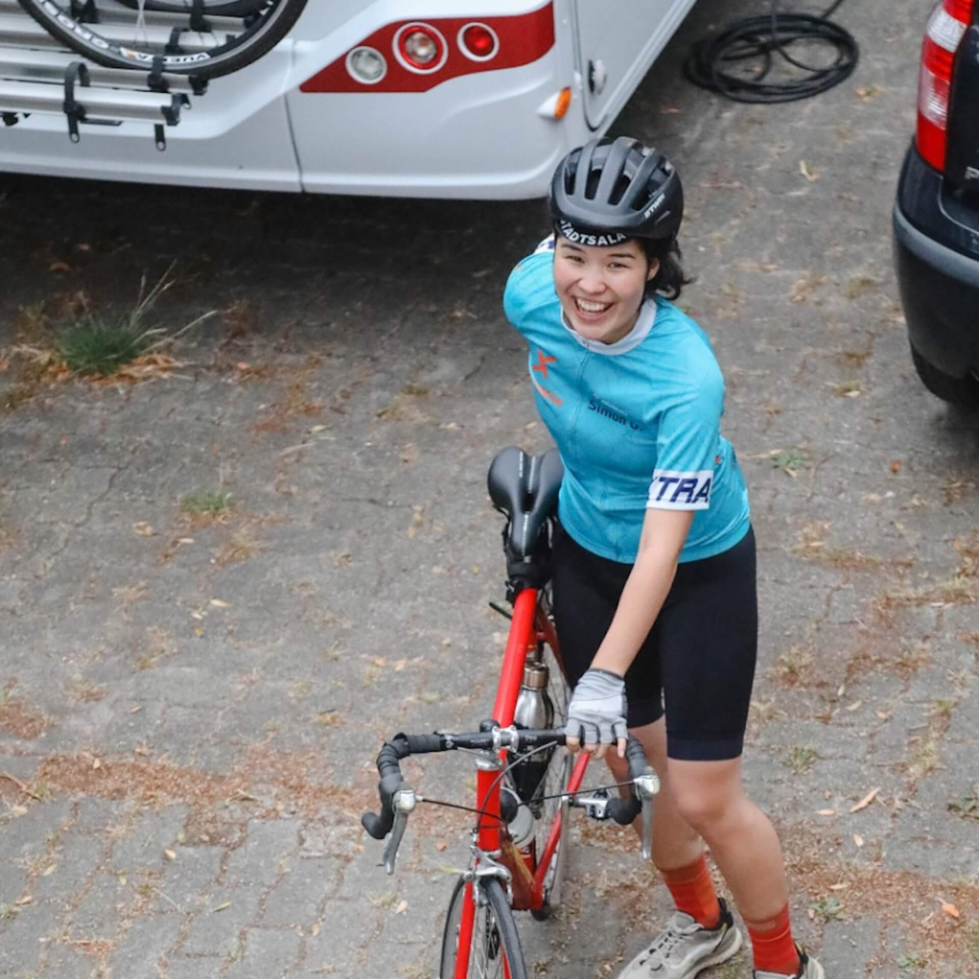 female athlete bike rider smiling